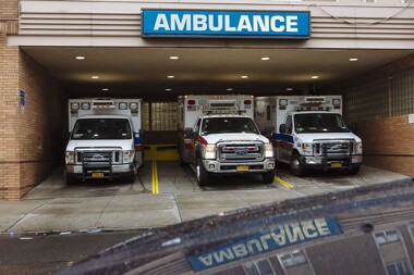 Three ambulances in a garage