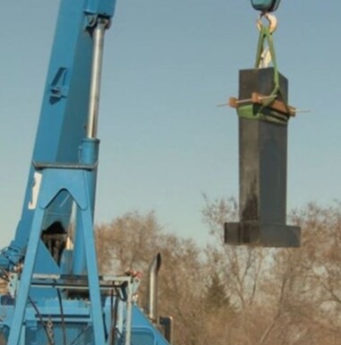 Vietnam Memorial being lifted by a crane