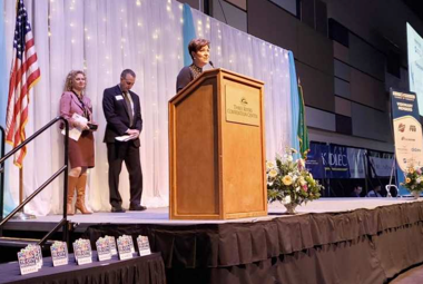 award honorees on stage