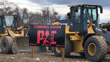 Coming soon sign for PAC at construction site