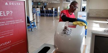 Kevin Jenkins of Dura-Shine clean disenfecting the ticketing area at the Tri-Cities airport