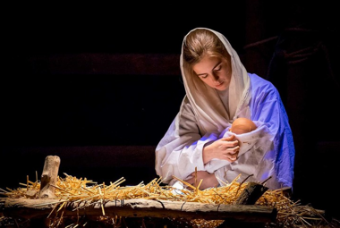 actress portraying Mary holding baby