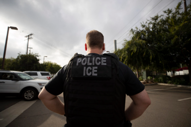 Police officer with Police ICE vest on