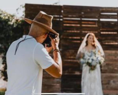 Photographer taking photos of bride