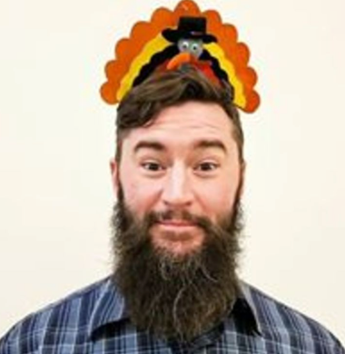 Man with turkey hat on