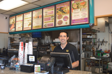 Man standing at cash register