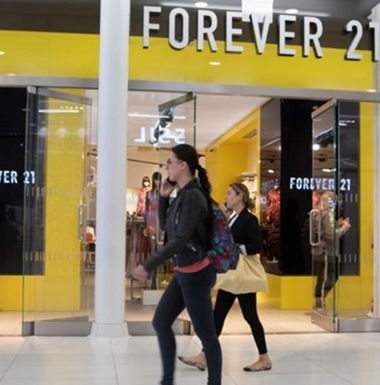 Forever 21 store front with people walking in front of it