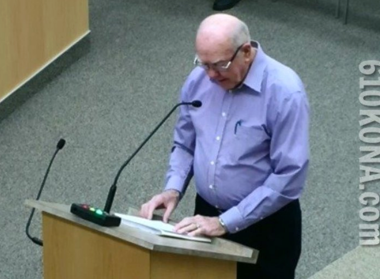 Man speaking at podium