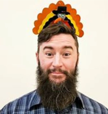Man with a turkey hat on