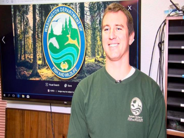 man standing in front of a tv screen