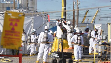 Hanford workers in haz mat suits