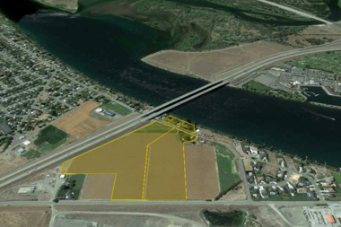 Land plot highlighted in aerial photo