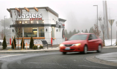 Roasters coffee shop with a car in front
