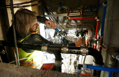 worker fixing pipes