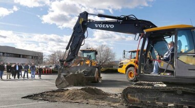 Benton County Commissioner Jim Beaver sits at the controls of an excavator