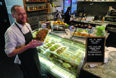 Man holding food at Endive Eatery