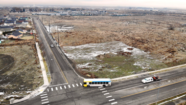 aerial photo of an empty plot of land on the corner of a street