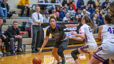 Pasco’s A’niyah Heavens dribbling the ball down court past Hanford’s Olivia Davis 