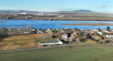 landscape photo of homes along a river