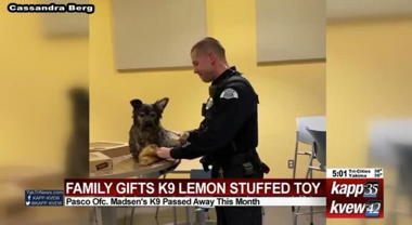 Police officer with stuffed dog