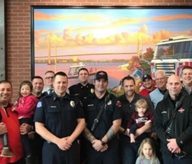 firefighters and family in a Firehouse Subs restaurant