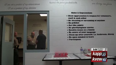 room inside a prison with rules of behavior written on it