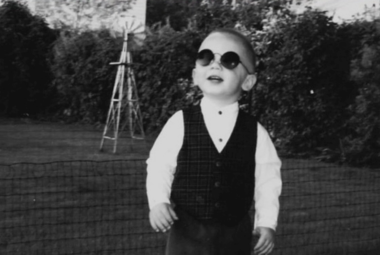 boy with tinted circular glasses on