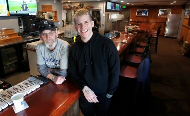 Dwayne and Jackson Woodward at Woody’s BullPen Bar and Grille