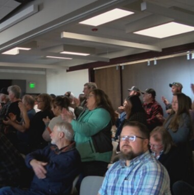 Crowd of people gathered to speak out at eminent domain meeting