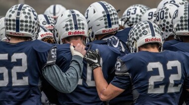 Chiawana football players huddled up