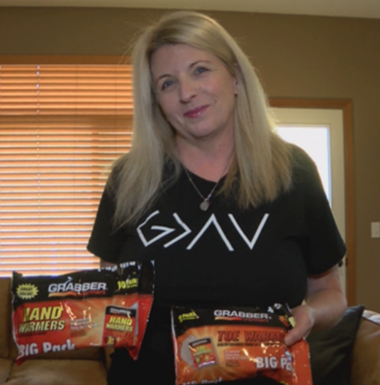 woman holding bags of hand warmers