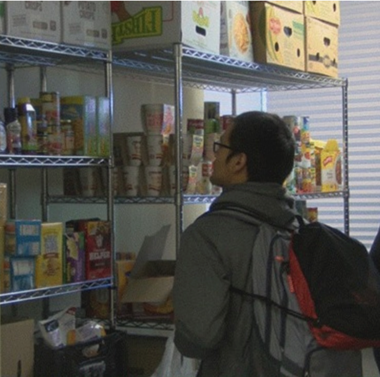 Man looking at shelves of food