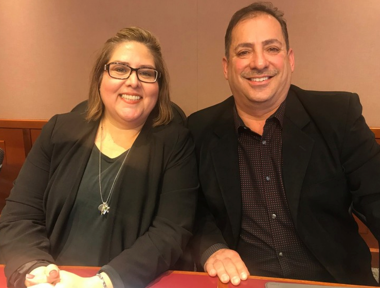 Saul Martinez and Blanche Barajas sitting together at a table