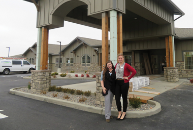 two women standing in front of the memory care facility