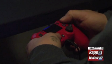 hands holding a play station controller
