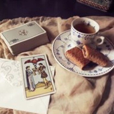 tea cup and tarot card