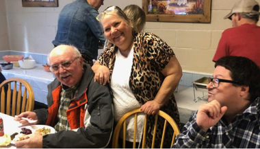 Mama, and an older man seated at a table, at Mama's diner in Benton City