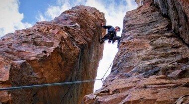 Climber Eddie Goss stemming up a chimney