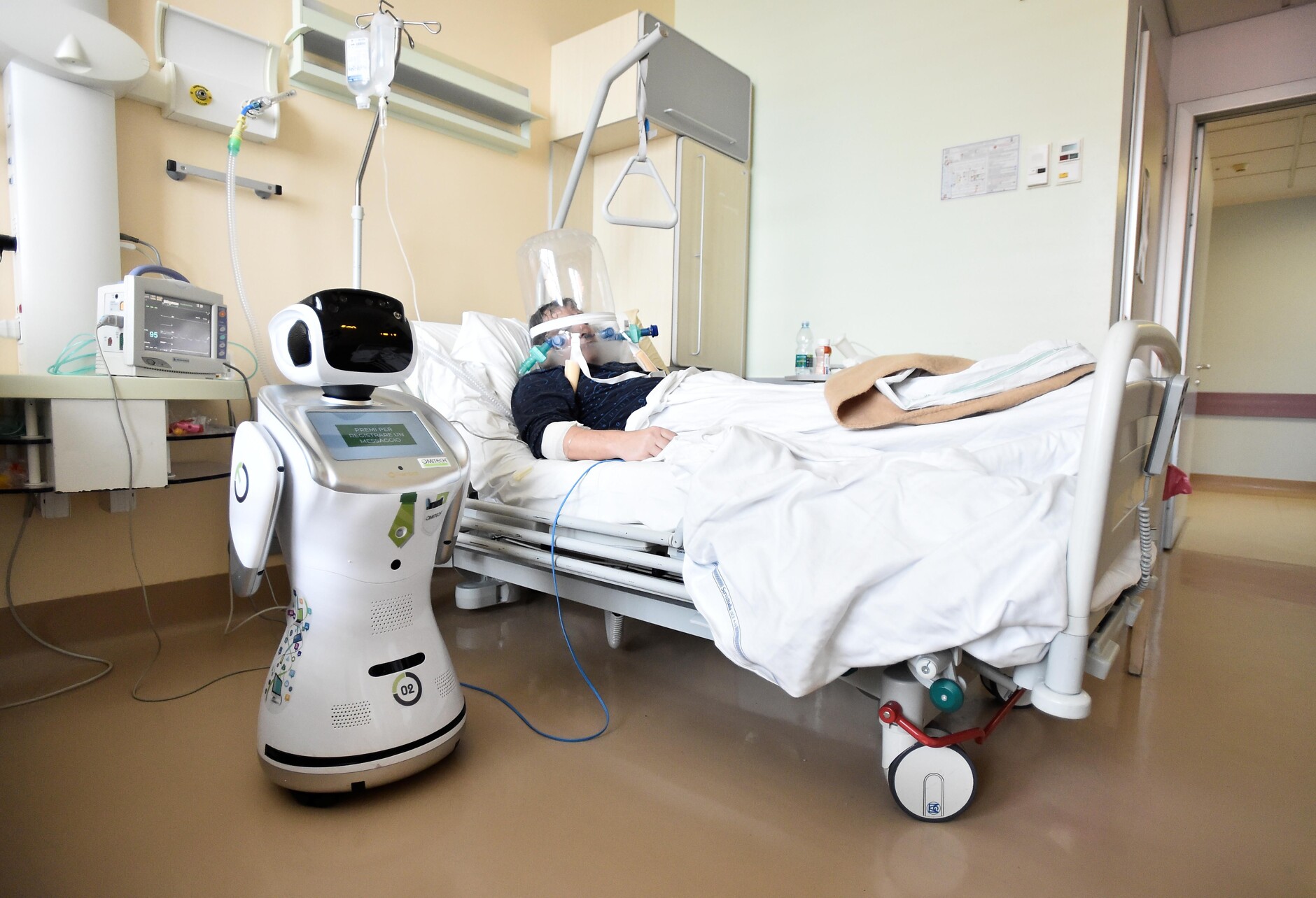 A robot healping treat a patient